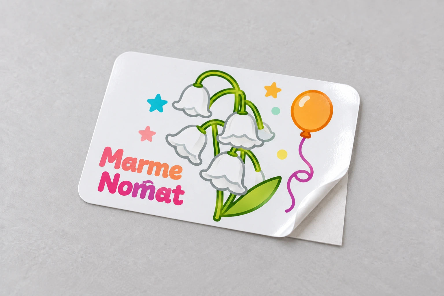 Rounded rectangle gloss vinyl sticker with floral artwork and a lifted corner