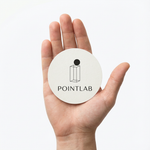 Round minimalist PointLab custom gloss sticker displayed in hand