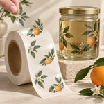1,000 custom 2-inch clear gloss roll labels with a transparent botanical label peeled from the liner