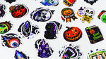 Fine glitter holographic custom stickers with Halloween designs on a white background