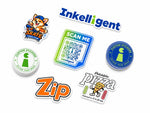 Custom white vinyl die-cut stickers with Inkelligent logos, a QR code, corgi, Zip and pizza designs