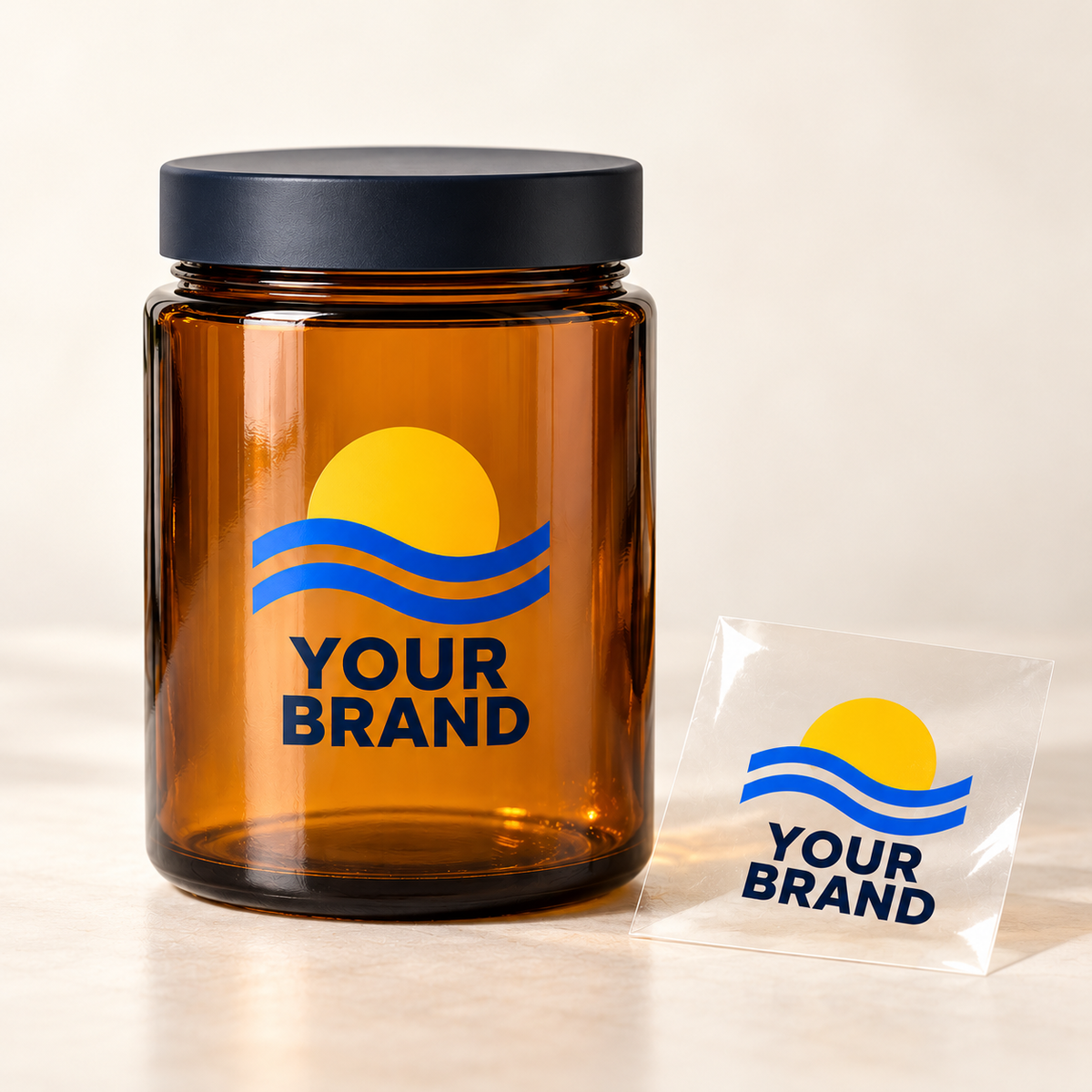 Illustrative custom transfer design on an amber glass jar with a matching clear carrier film sample; jar not included