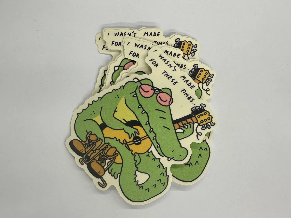 Stack of illustrated die-cut crocodile stickers