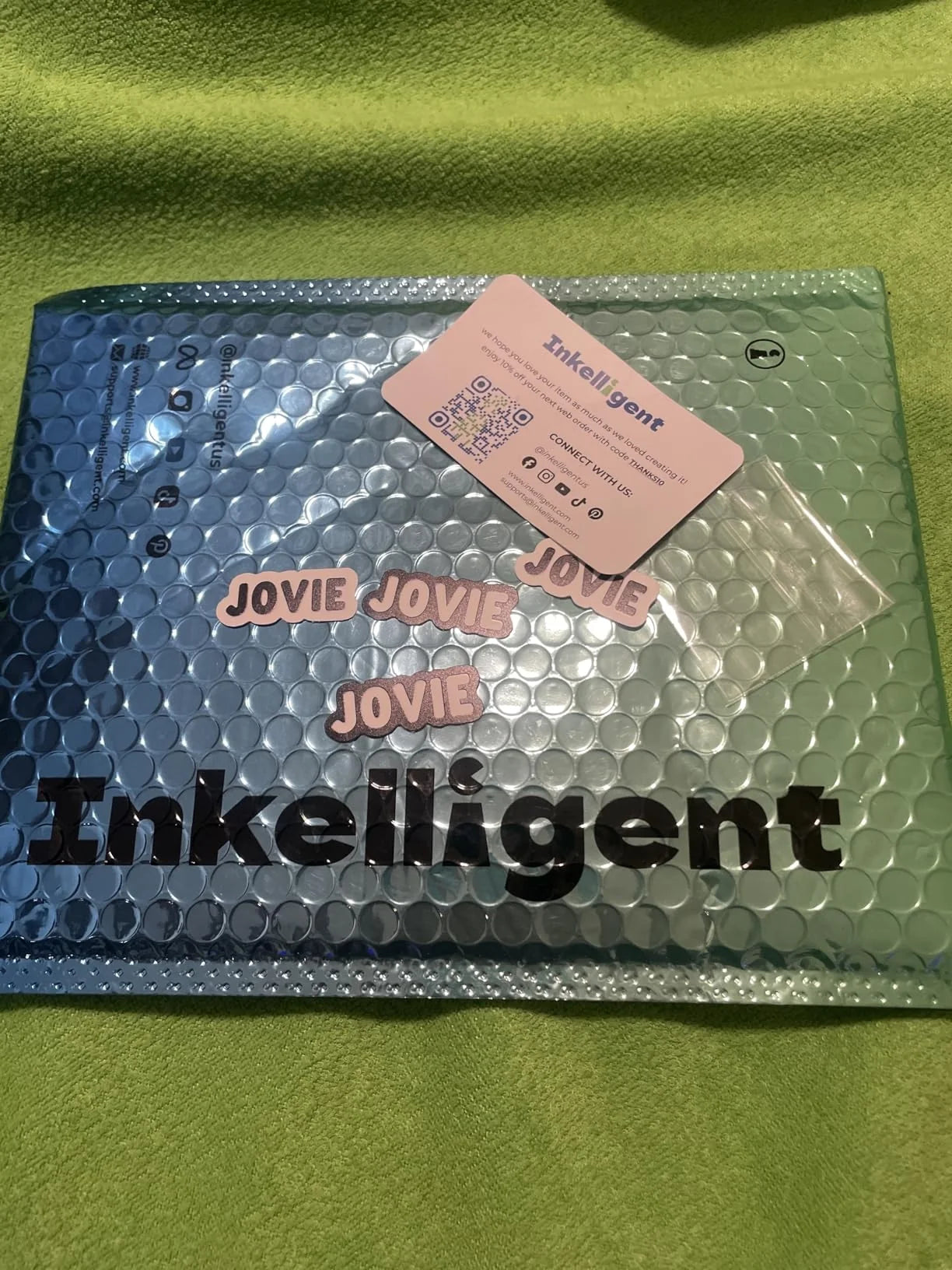 Customer photo of custom name decals and logo stickers on Inkelligent packaging