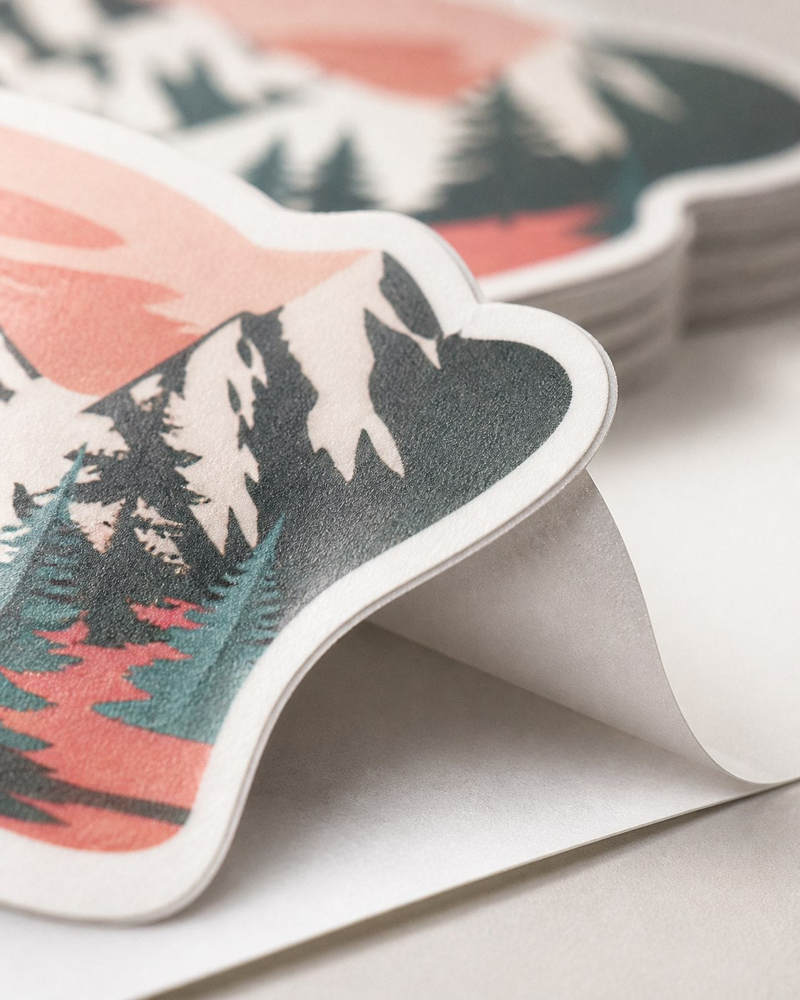 Macro view of a matte sticker face, crisp printed edge, and backing layer